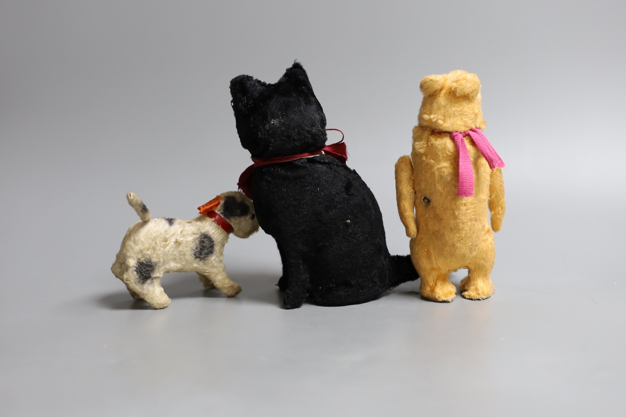 Three children's clockwork toys, a black cat, bear and a dog, car 16cms high